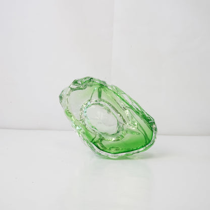 A textured green glass sculptural piece
Handcrafted green glass object with textured finish