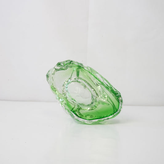 A textured green glass sculptural piece
Handcrafted green glass object with textured finish